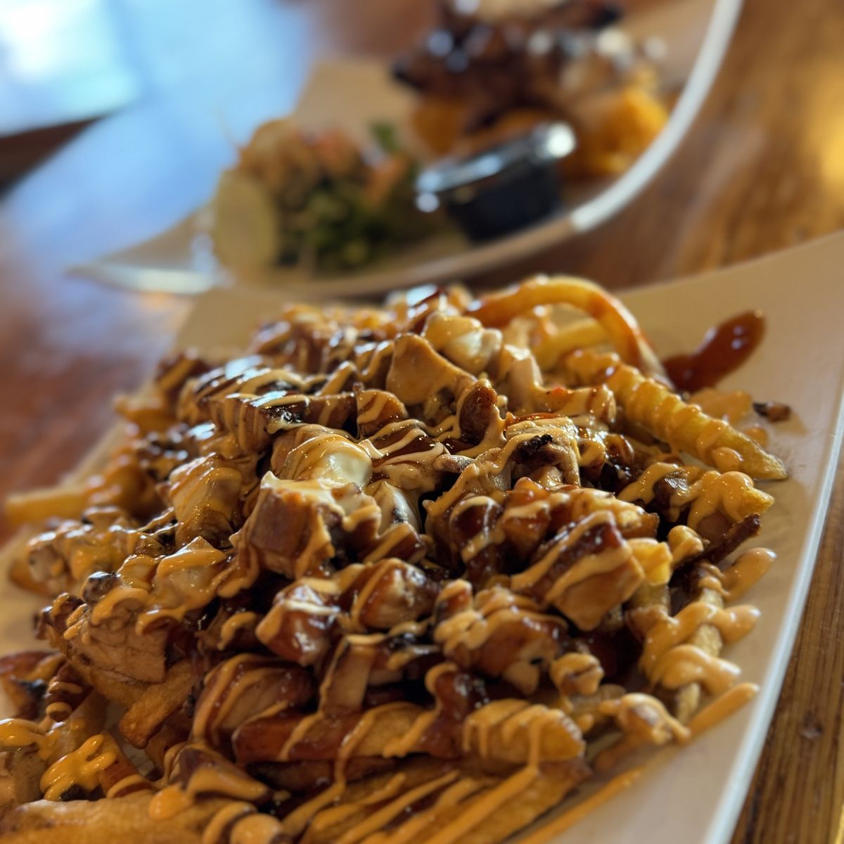 Fries topped with sauced grilled meat from Guahan Grill