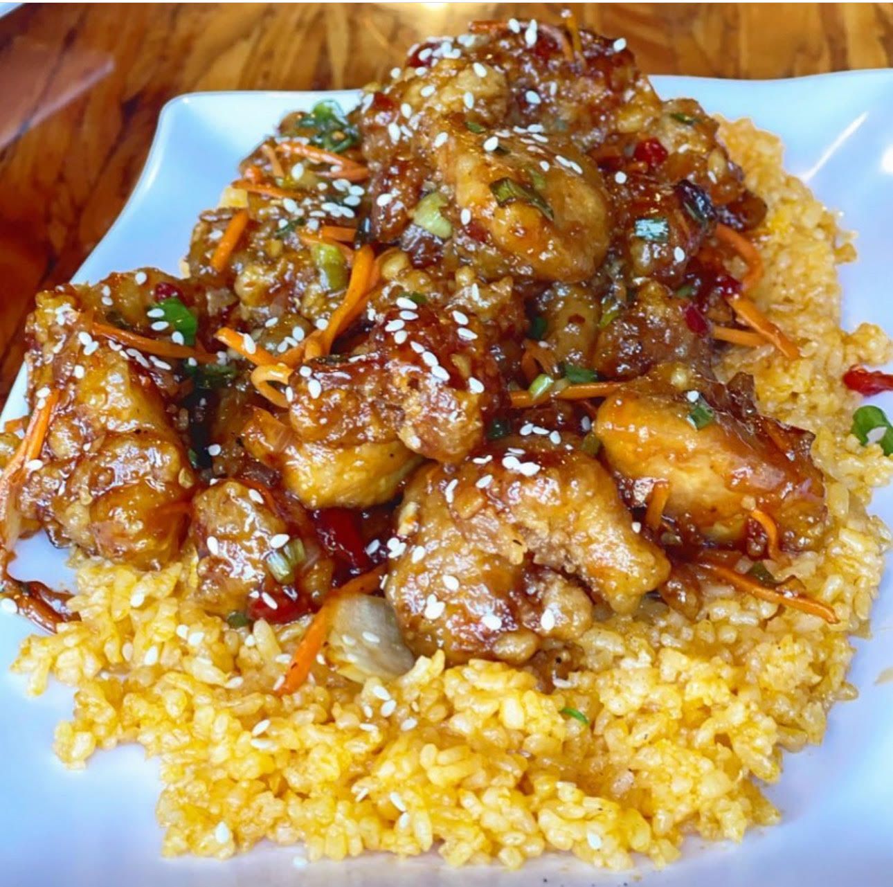 A glazed crispy chicken dish over rice at Guahan Grill