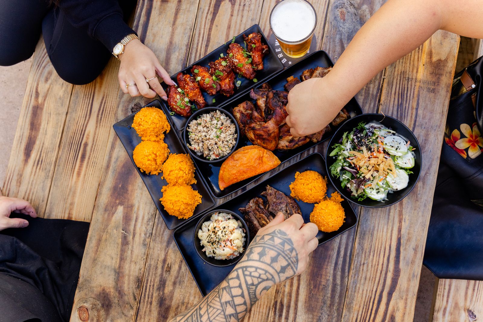 A table spread of Chamorro dishes from Guahan Grill in Oceanside, California